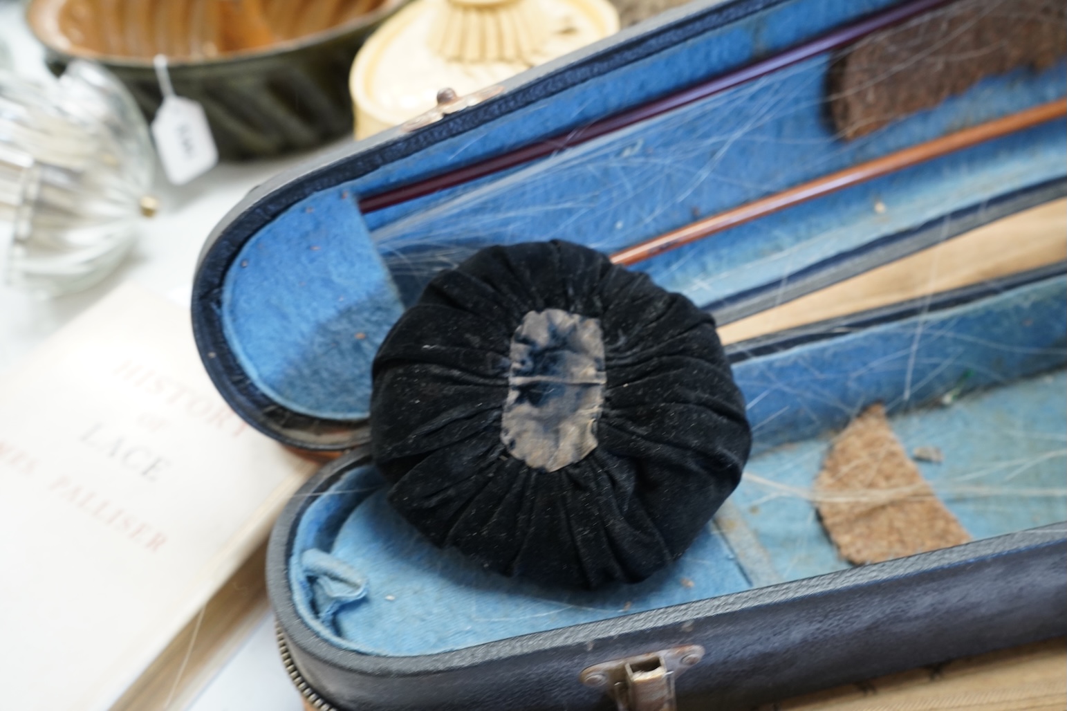 An early 20th century cased violin and cover, 60cm long